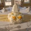 Centerpiece of white hydrangea, white carnations and yellow roses